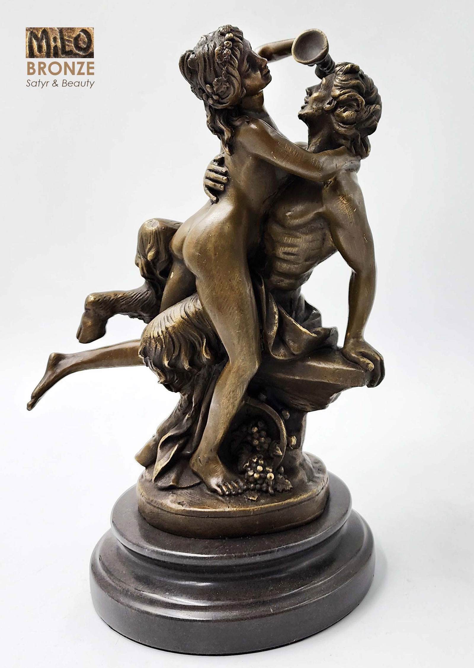 Satyr & The Beauty Nymph, An Original Milo Signed Bronze Figurine Group: Satyr & The Beauty Nymph, An Original Milo (contemporary artist) Bronze Figurine Group Statue On Black Marble Base, First edition, Singed. H 12" x 8" x 6", Weight: 10 lbs.
