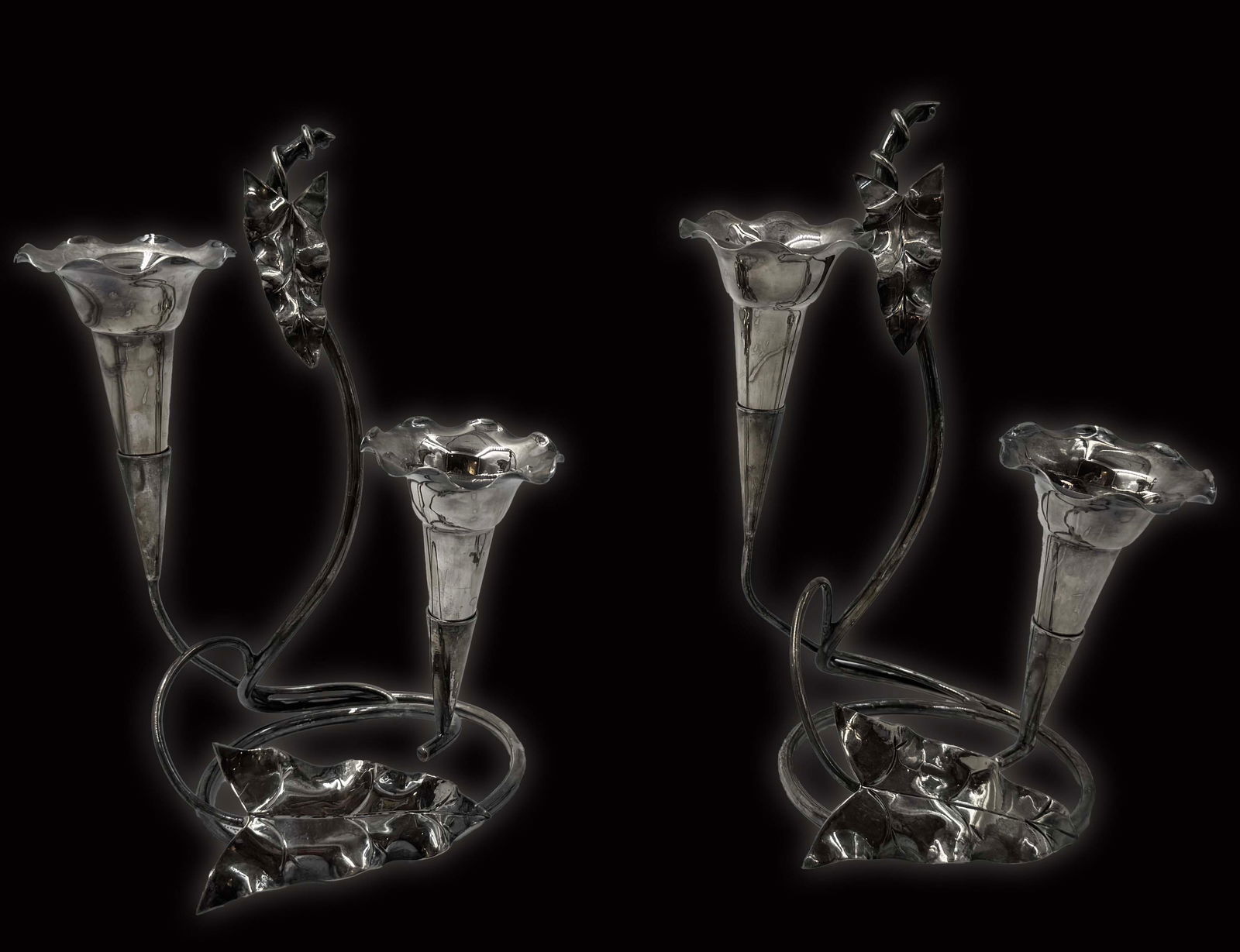 A Pair Of Silver-Plate Candelabras: A Pair Of Silver-Plate Candelabras. 6" x 4.5" x H 7.5"