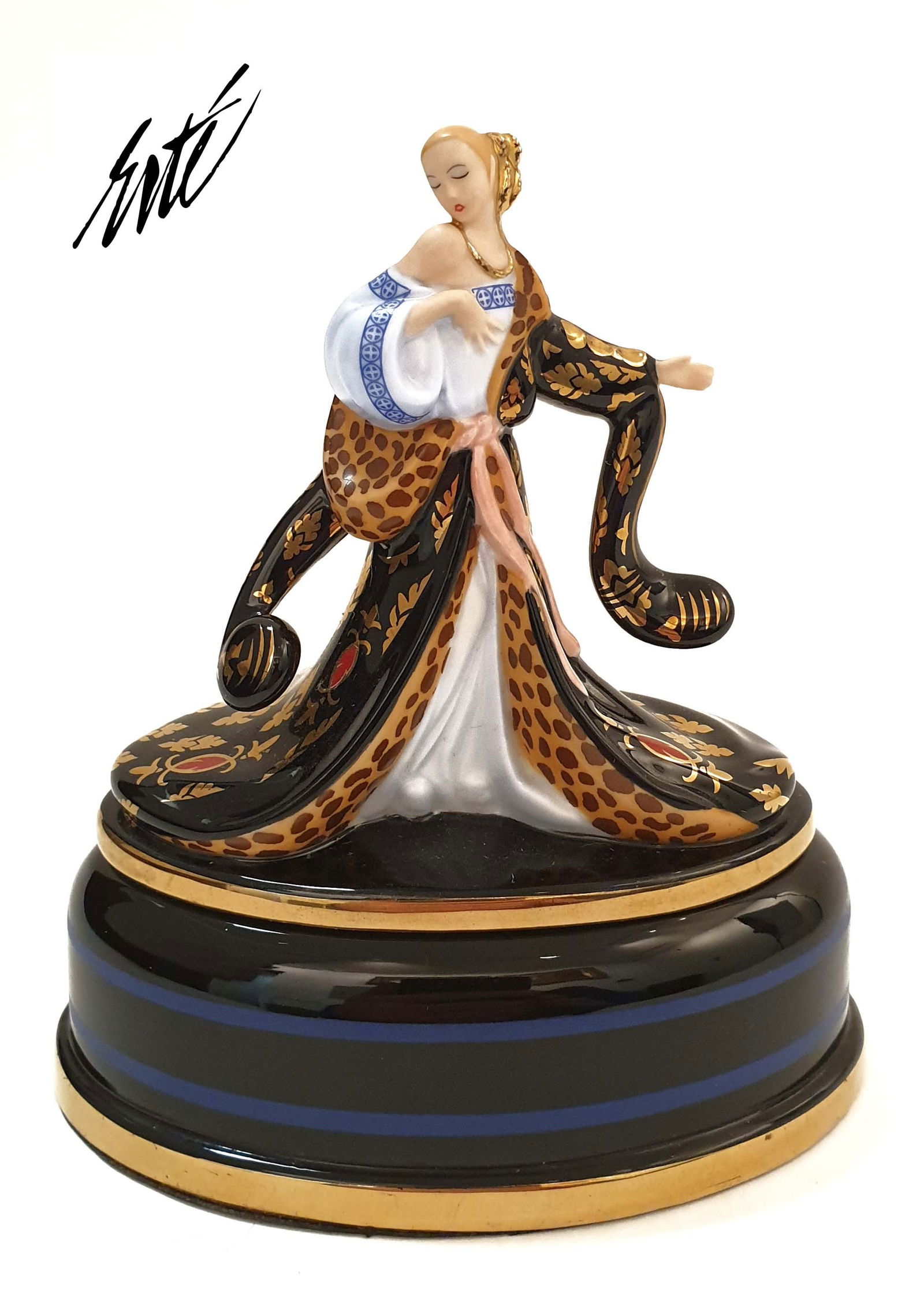 Rigoletto, House of ERTE Figural Music Box: Rigoletto, A Rare The Franklin Mint House of ERTE Porcelain Figural Music Box. Sevenarts Ltd Hallmarked. The item has 2 pieces. The title and song of this music box is "Rigoletto". Total Size: 4" x 2.