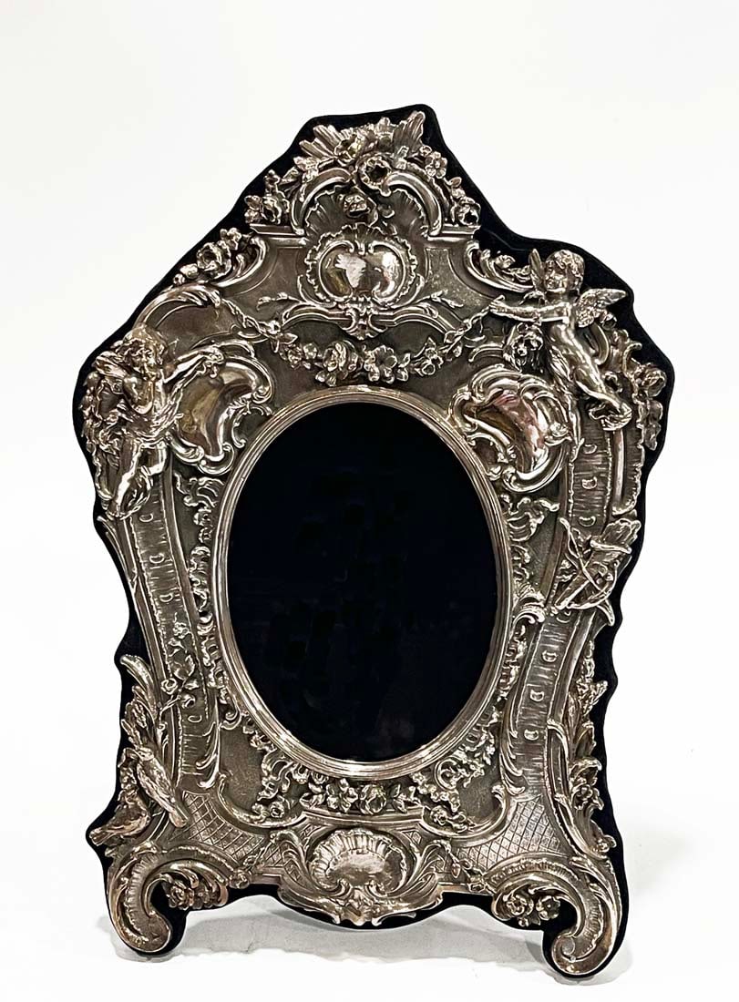 A Sterling Silver 925 Figural Frame: A Sterling Silver 925 Figural Frame. Frame: H 12" x 8", Canvas: 5.5" x 4"