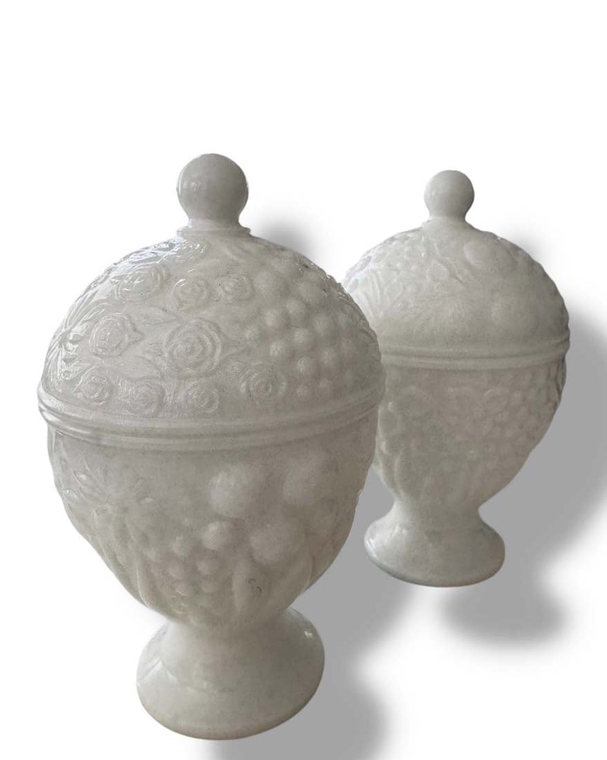 A Pair of Vintage Avon Milk Glass Egg Shaped Lidded Jar Compote/Urns: A Pair of Vintage Avon Milk Glass Egg Shaped Lidded Jar Compote/Urns. H 6" x D 4"