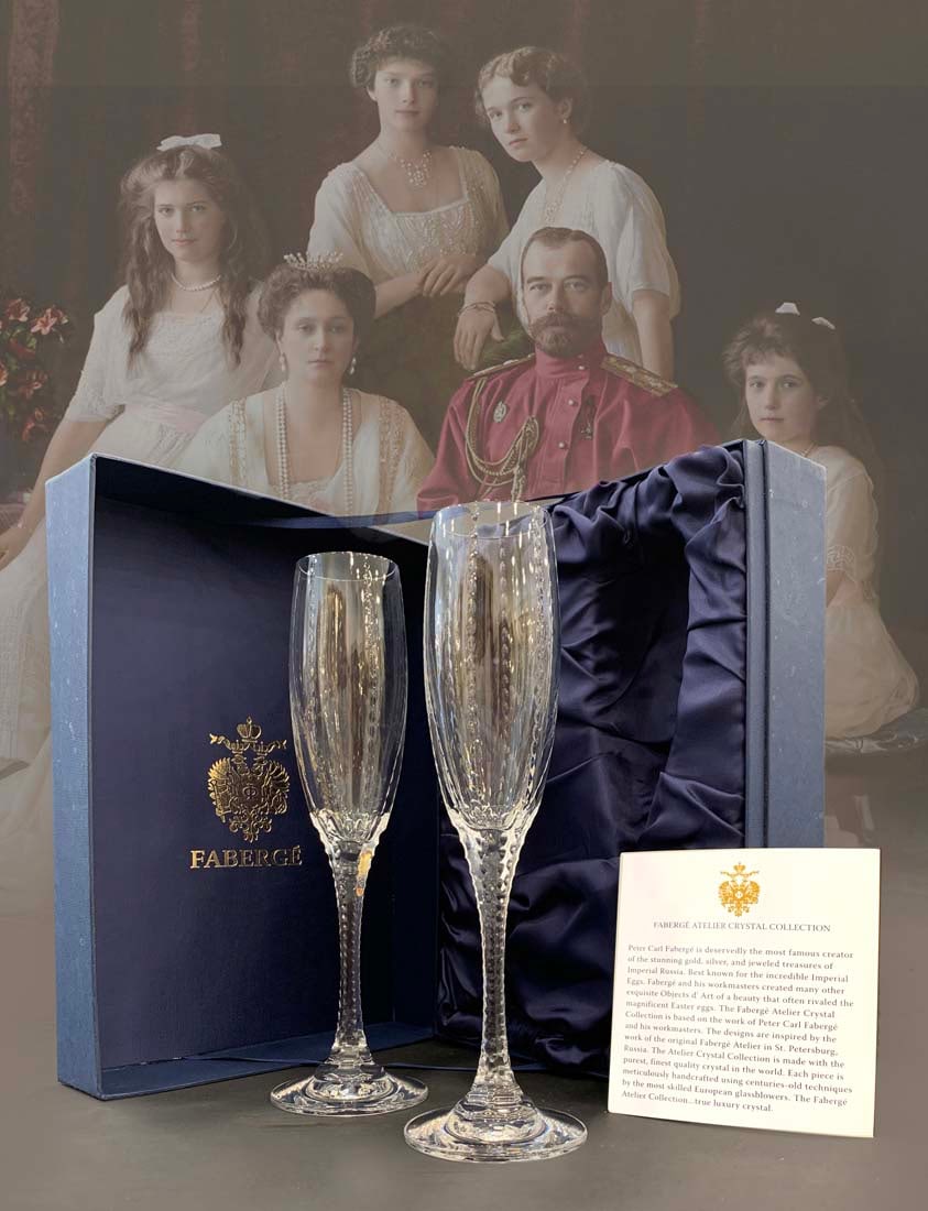 A Pair of The House of Faberge Atelier Crystal Champagne Flutes, Boxed: A Pair of The House of Faberge Bristol Atelier Crystal Champagne Flutes in Original Box. Flutes size: H 10"