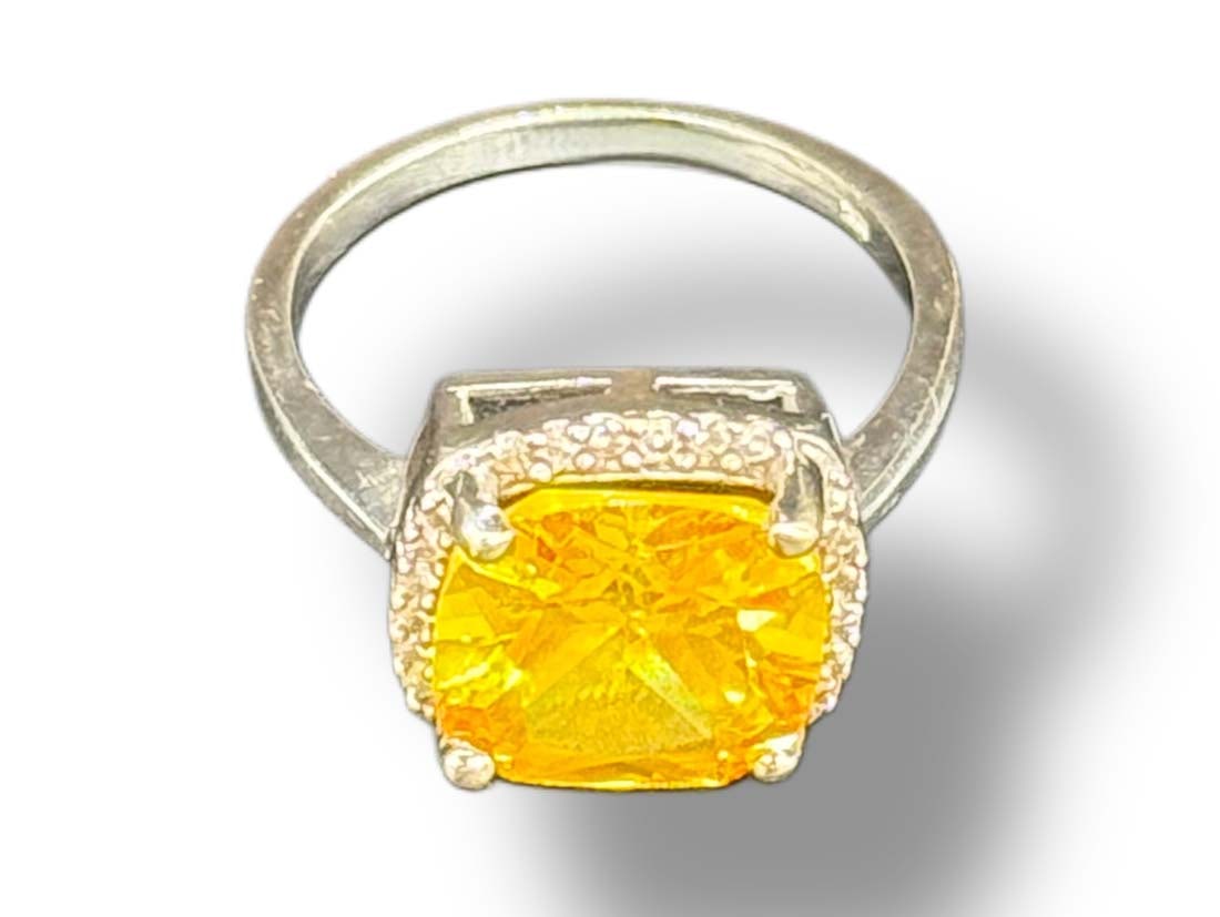 6 Carat Citrine & Halo VS/SI Diamond 18K White Gold Ring: 6 Carat Citrine & Halo VS/SI Diamond 18K White Gold Ring. Main Stone: Citrine, Number of stones: 1, Carat weight: 5.75, Cut: Cushion, Quality: AAA, Color: Translucent Yellow, Stone Treatment:
