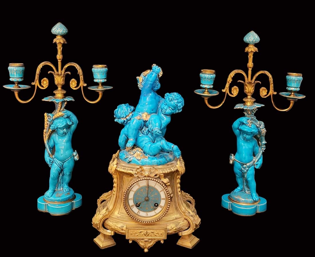 19th Century French Sevres Figural Blue Porcelain Bronze Clock Set: 19th Century French Sevres Figural Blue Porcelain Bronze Clock Set. Clock: 8" x 9.5" x 15" H, Candelabras: 10" x 5" x 18" H