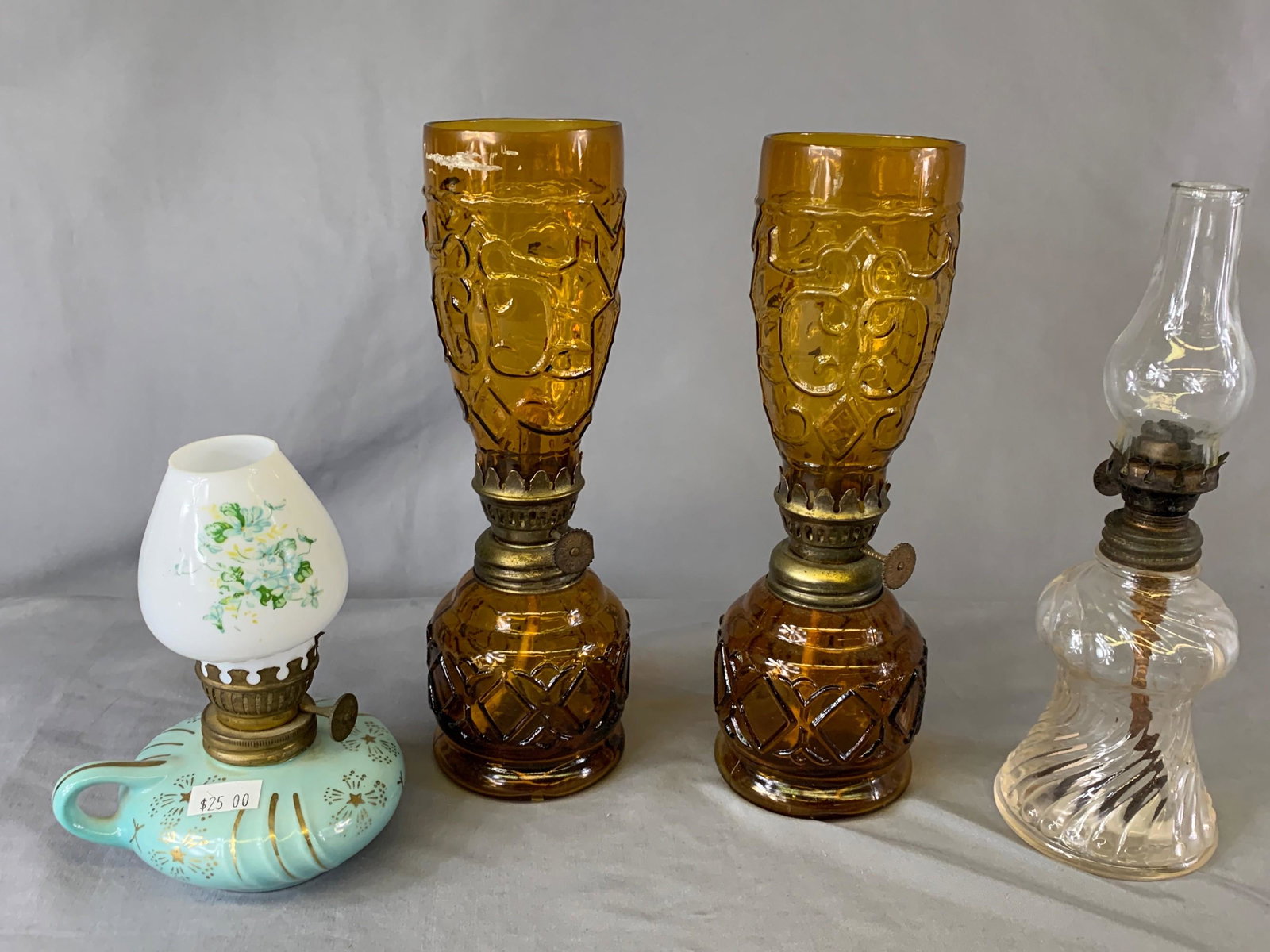 Four Oil Lamps: Glass and Porcelain: Measurements: 9” and under