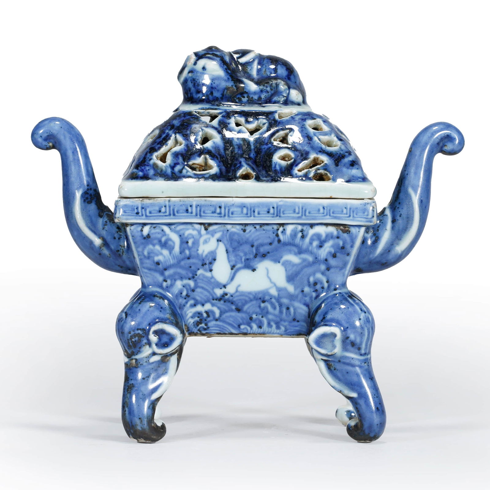 Blue And White Double-Ears Censor: Blue And White Double-Ears Censor Width:21cm.Height:19cm. Provenance: Acquired from Chinese Antique Shop released out around late Qing Dynasty. Blue and white censor, of hollow-carved design cover wit