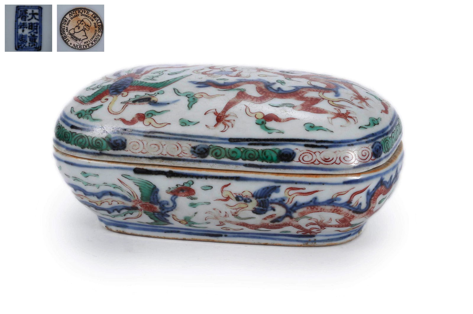 A Wucai Glaze Dragon Box And Cover: A Wucai Glaze Dragon Box And Cover 5 1/8 in. (15 cm.) wide Wanli Six-Character Mark. Provenance: Acquired from the British Antique Dealer Association. From the collection of William Cleverly.