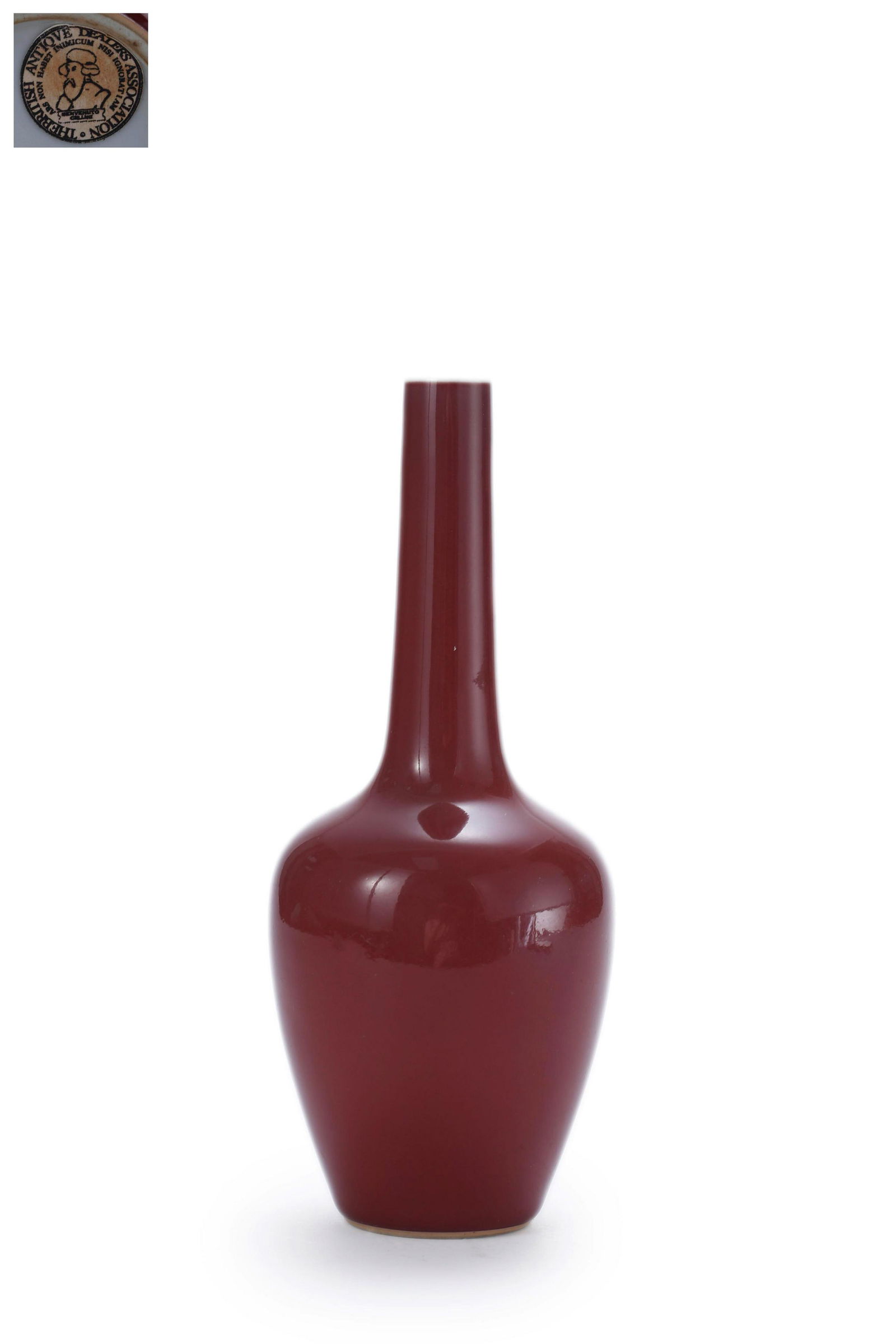 A Red Glaze Long-Neck Vase: A Red Glaze Long-Neck Vase 8 1/2 in. (21.5 cm.) high Provenance: Formerly in the collection of British Antique Dealer Association.