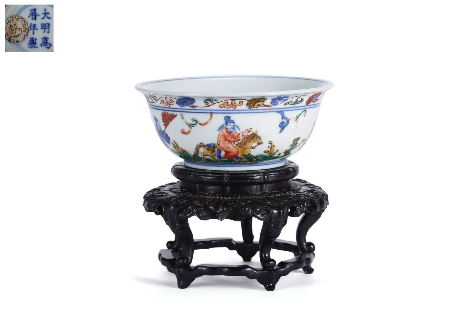 A Wucai Glaze Figure Story Bowl: A Wucai Glaze Figure Story Bowl 4 1/2 in. (11.5 cm.) diam. Wanli Six-Character Mark. Provenance: Acquired from the British Antique Dealer Association. From the collection of William Cleverly.