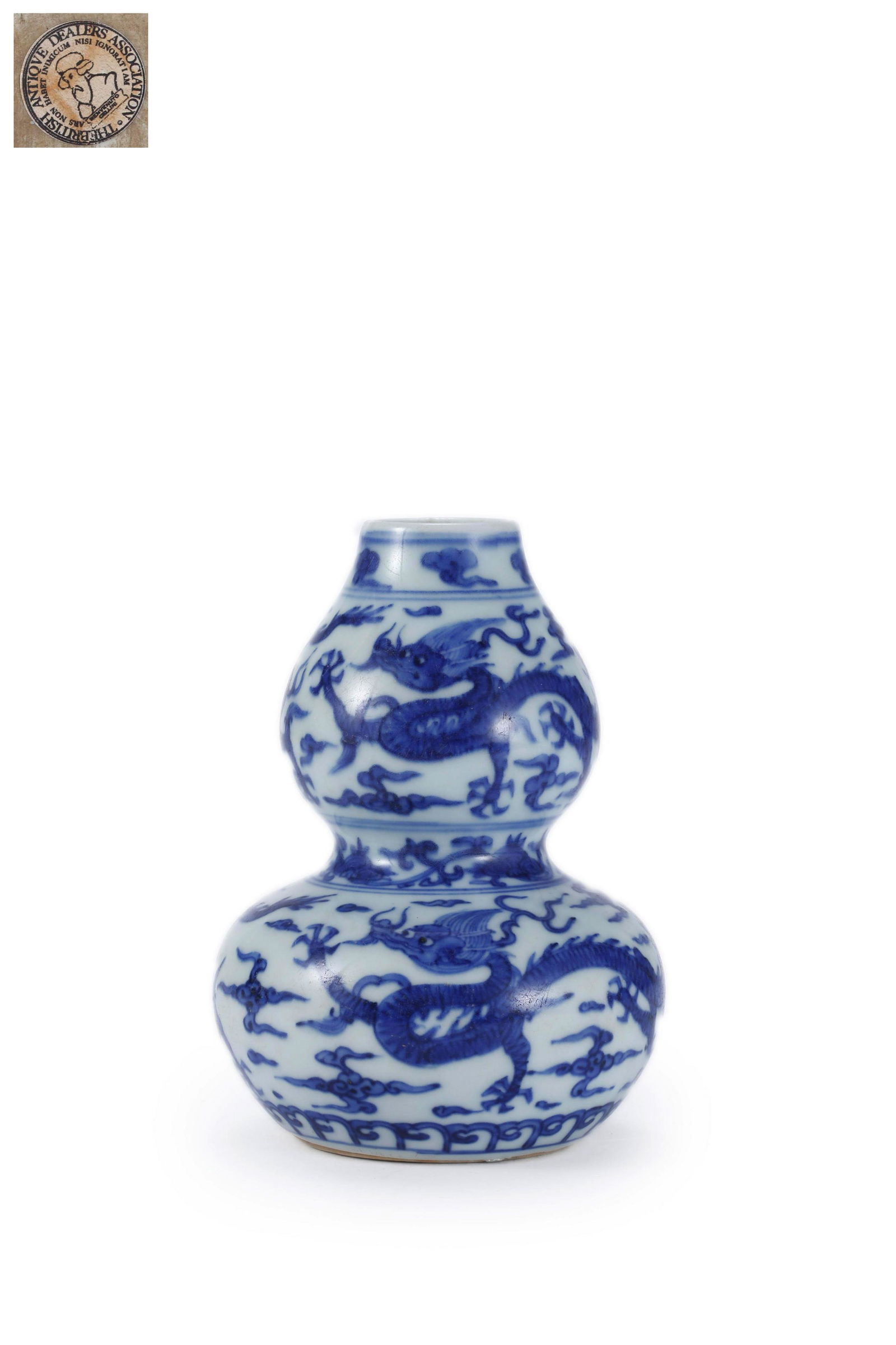 A Blue And White Dragon Gourd-Shape Vase: A Blue And White Dragon Gourd-Shape Vase 5 in. (12.5 cm.) high Provenance: Formerly in the collection of British Antique Dealer Association.