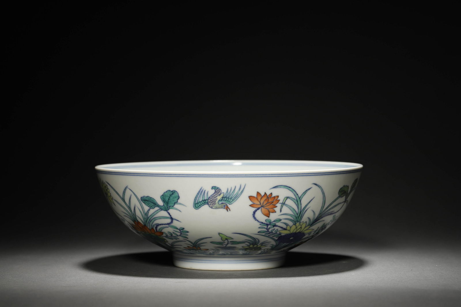 A Doucai Glaze Lotus Pond Bowl: A Doucai Glaze Lotus Pond Bowl D: 20.6cm , H: 7.7cm Provenance: Acquired from the British Antique Deals Association.