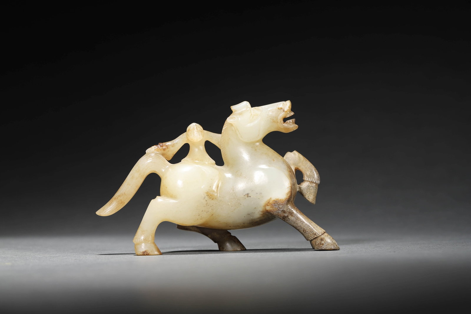 A Carved Jade Figure And Horse: A Carved Jade Figure And Horse H: 6.5cm, W: 10.5cm,