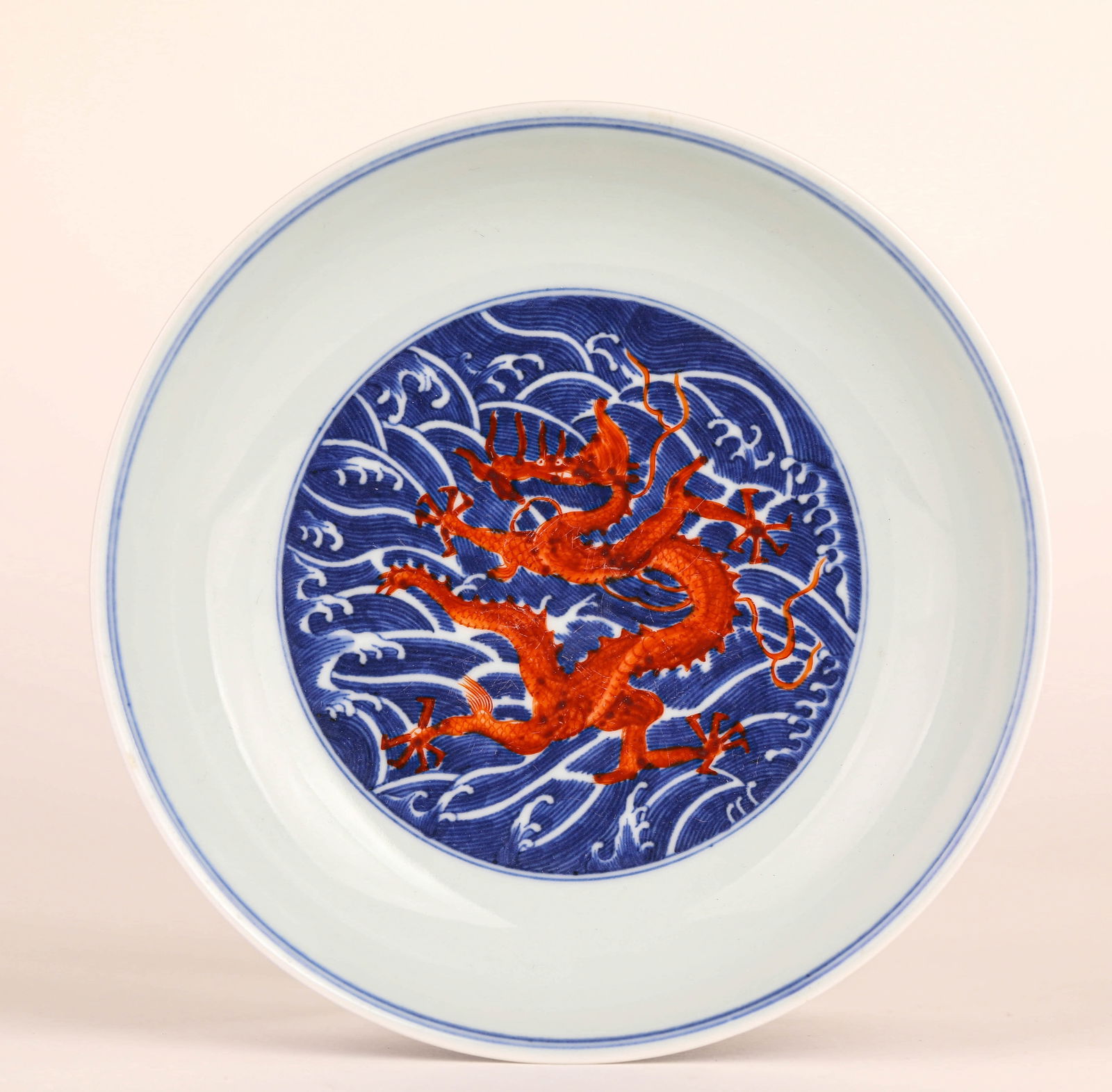 A BLUE AND WHITE IRON-RED DRAGON PLATE (1 of 6)