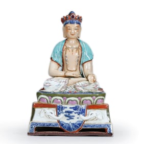 A FAMILLE ROSE FIGURE OF BUDDHA