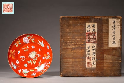 A CORAL-RED GROUND FAMILLE ROSE BUTTERFLY FOLIATE-RIMMED DISH