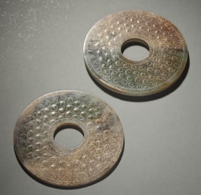 A PAIR OF CELADON JADE DISCS, BI