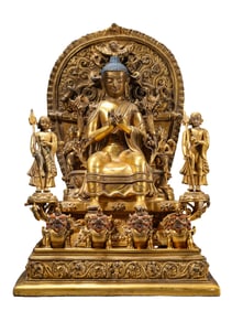 A GILT-BRONZE FIGURE OF SEATED BUDDHA