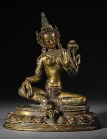 A GILT-BRONZE FIGURE OF SEATED GREEN TARA
