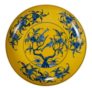 A YELLOW GROUND BLUE AND WHITE BIRD AND FLOWER DISH