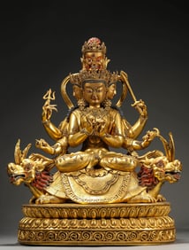 A GILT-BRONZE FIGURE OF SEATED BUDDHA