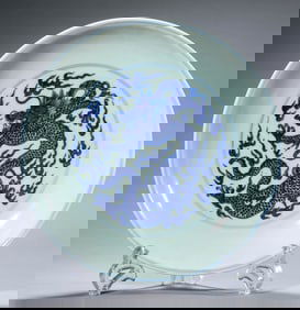 A BLUE AND WHITE DRAGON DISH