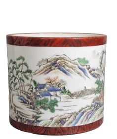 A FAUX BOIS-ENAMELED FAMILLE ROSE LANDSCAPE AND FIGURES BRUSH POT