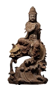 A PAINTED NANMU WOOD FIGURE OF DRAGON-SUBDUING GUANYIN