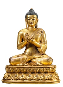 A GILT-BRONZE FIGURE OF SEATED SHAKYAMUNI