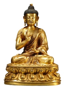 A GILT-BRONZE FIGURE OF SEATED SHAKYAMUNI