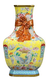 A FAMILLE ROSE YELLOW-GROUND BUTTERFLIES AND FLOWERS SASH-TIED VASE