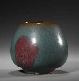 A GREEN-GLAZED PURPLE-SPLASHED JAR
