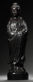 A CARVED ZITAN FIGURE OF STANDING GUANYIN