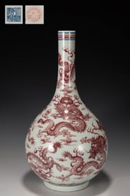 A BLUE AND WHITE AND UNDERGLAZE RED CLOUD AND DRAGON BOTTLE VASE