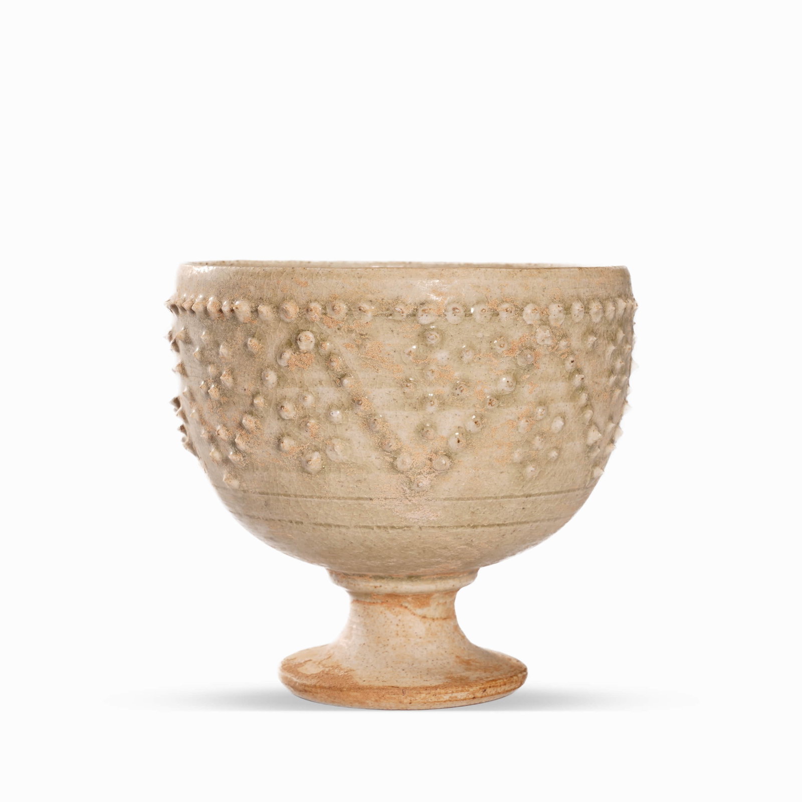 A CELADON ‘LOTUS’ STEM-CUP: Dimensions: Height: 9 cm (3.54 in.), Diameter: 8.5 cm (3.35 in.). All measurements are approximate.