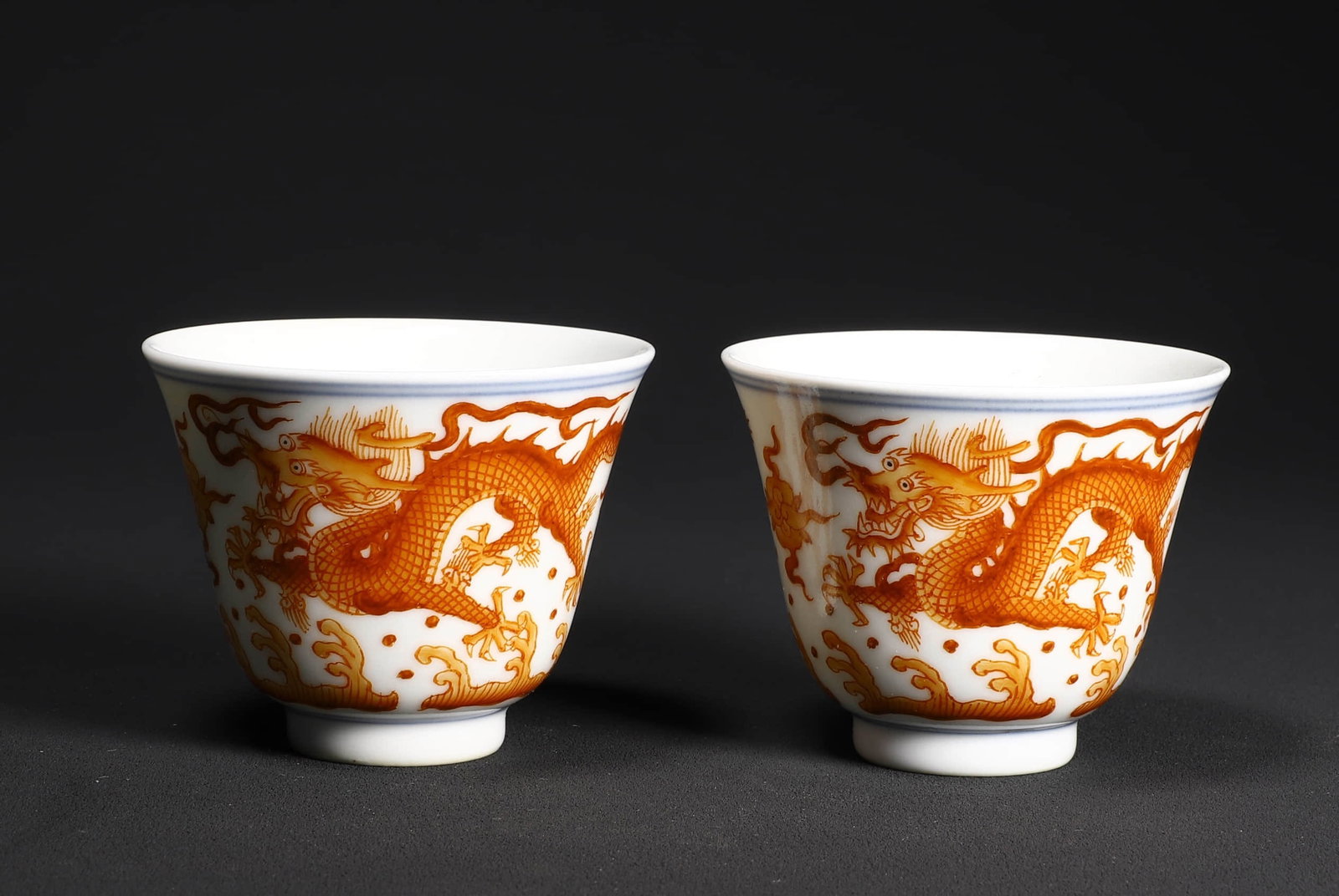 A PAIR OF IRON-RED 'DRAGON' CUPS (1 of 4)