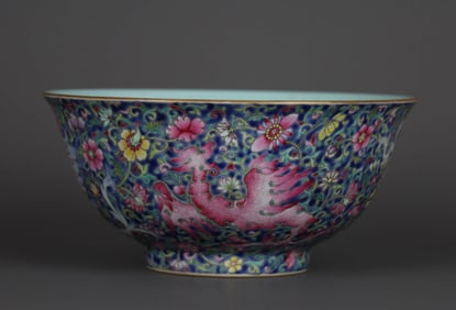 A BLUE-GROUND FAMILLE ROSE 'KUI PHOENIX AMONG FLOWERS' BOWL