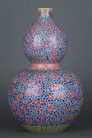 A FAMILLE ROSE 'ICE PLUM AND BAMBOO' GOURD SHAPED VASE
