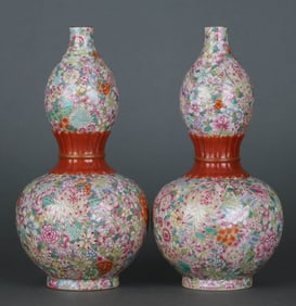 A FAMILLE ROSE 'MILLEFLEURS' GOURD SHAPED VASE