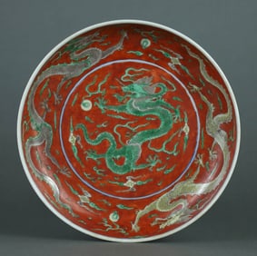 A SANCAI IRON-RED GROUND 'DRAGON' DISH