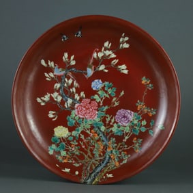 A IRON-RED GROUND FAMILLE-ROSE 'BIRDS AND FLOWERS' DISH