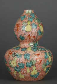 A FAMILLE ROSE AND IRON RED 'PHOENIX AND FLORAL' GOURD SHAPED VASE