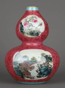 A FAMILLE ROSE MEDALLION 'LANDSCAPE AND FLORAL' GOURD VASE