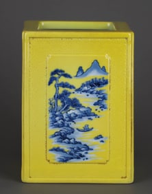 A YELLOW-GLAZED CARVED AND BLUE-PAINTED 'LANDSCAPE' BRUSH POT