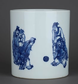 A BLUE AND WHITE 'KICKING BALL' BRUSH POT