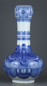 A BLUE AND WHITE 'ANIMAL FACE' GARLIC-SHAPED VASE