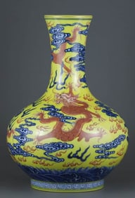 A YELLOW-GLAZED BLUE AND IRON-RED 'FIVE DRAGONS' VASE