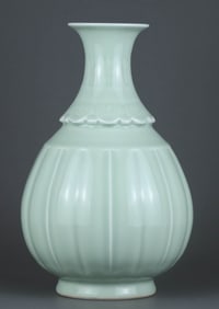 A PALE CELADON-GLAZED CARVED 'BANANA LEAF AND RUYI' YUHUCHUNPING