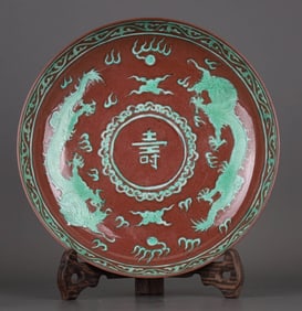 A BROWN-GLAZED AND GREEN-PAINTED 'DRAGON AND SHOU' DISH