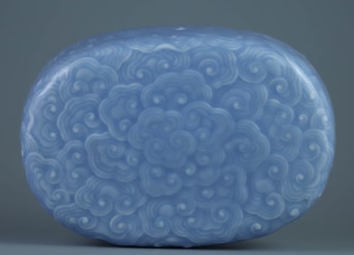 A SKY-BLUE GLAZED CARVED 'RUYI' HAND REST