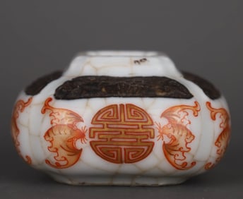 A GE GLAZED IRON RED AND GILT DECORATED 'SHOU' BOWL